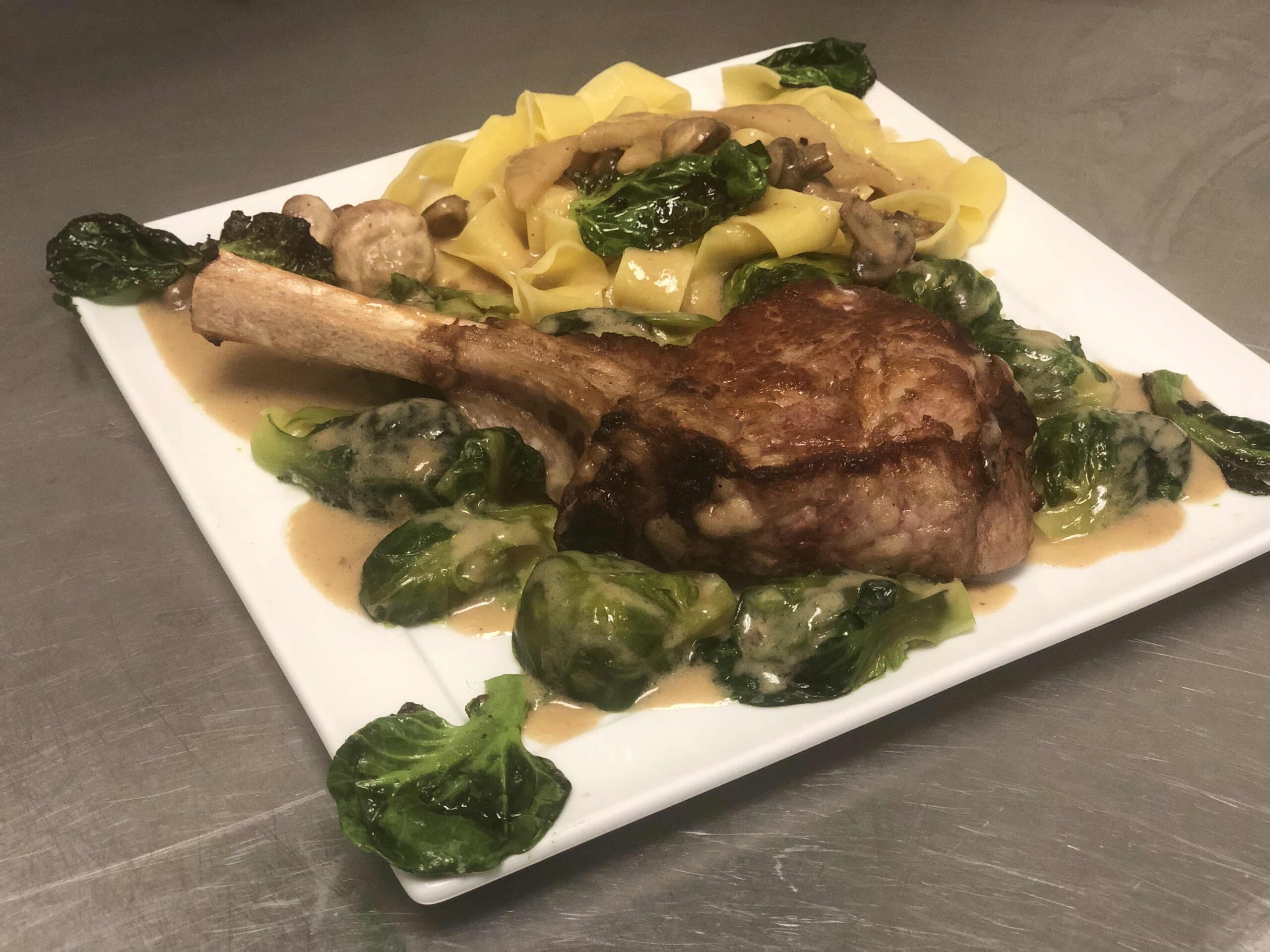 Pan-Roasted Veal Chop in Apple-Mushroom Cream with Handmade Noodles and Brussels Sprouts