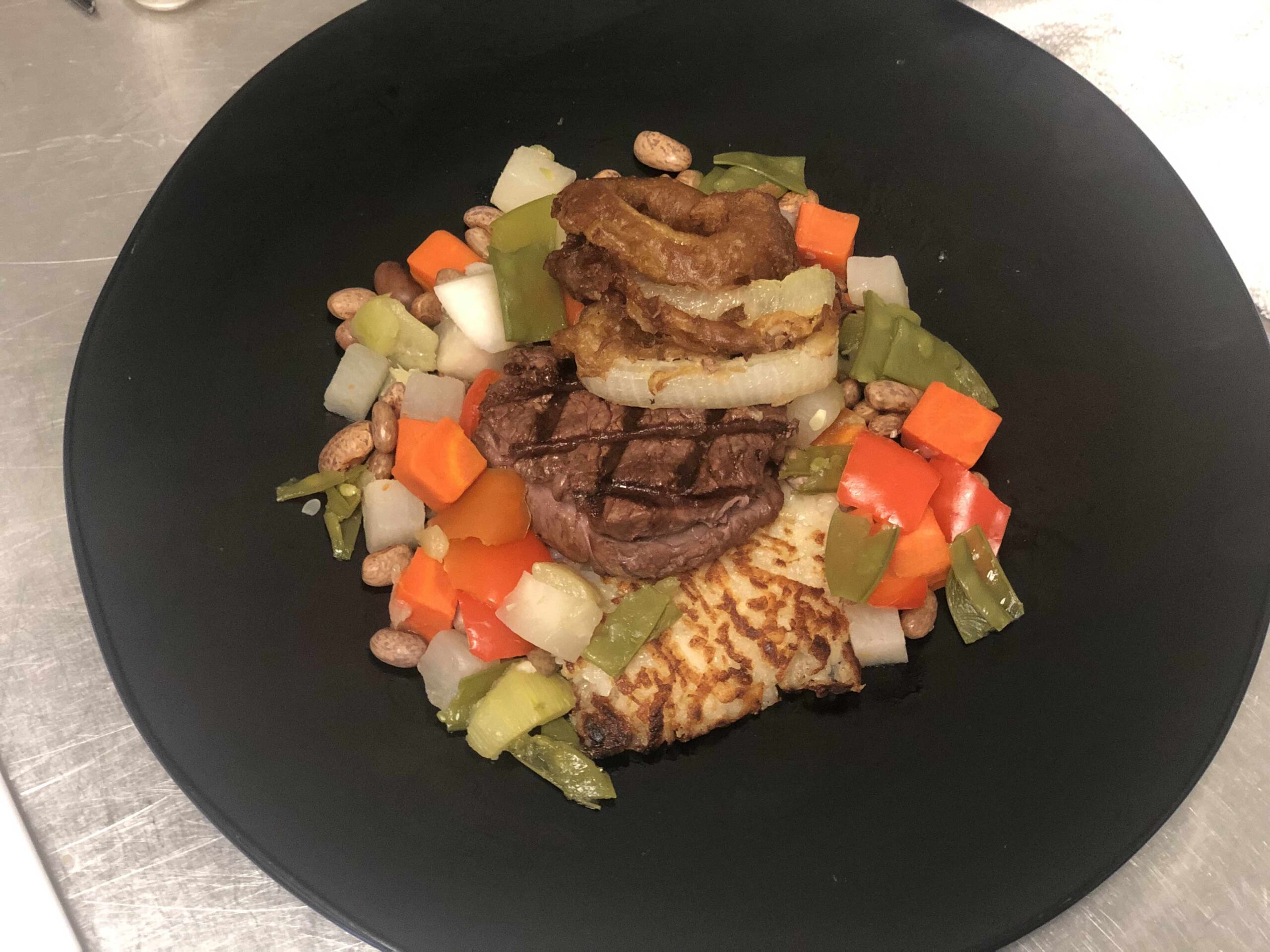 Grilled Filet of Bison with Smoky Steak Sauce, Beer-Batter Onion Rings, Hash Brown Potatoes