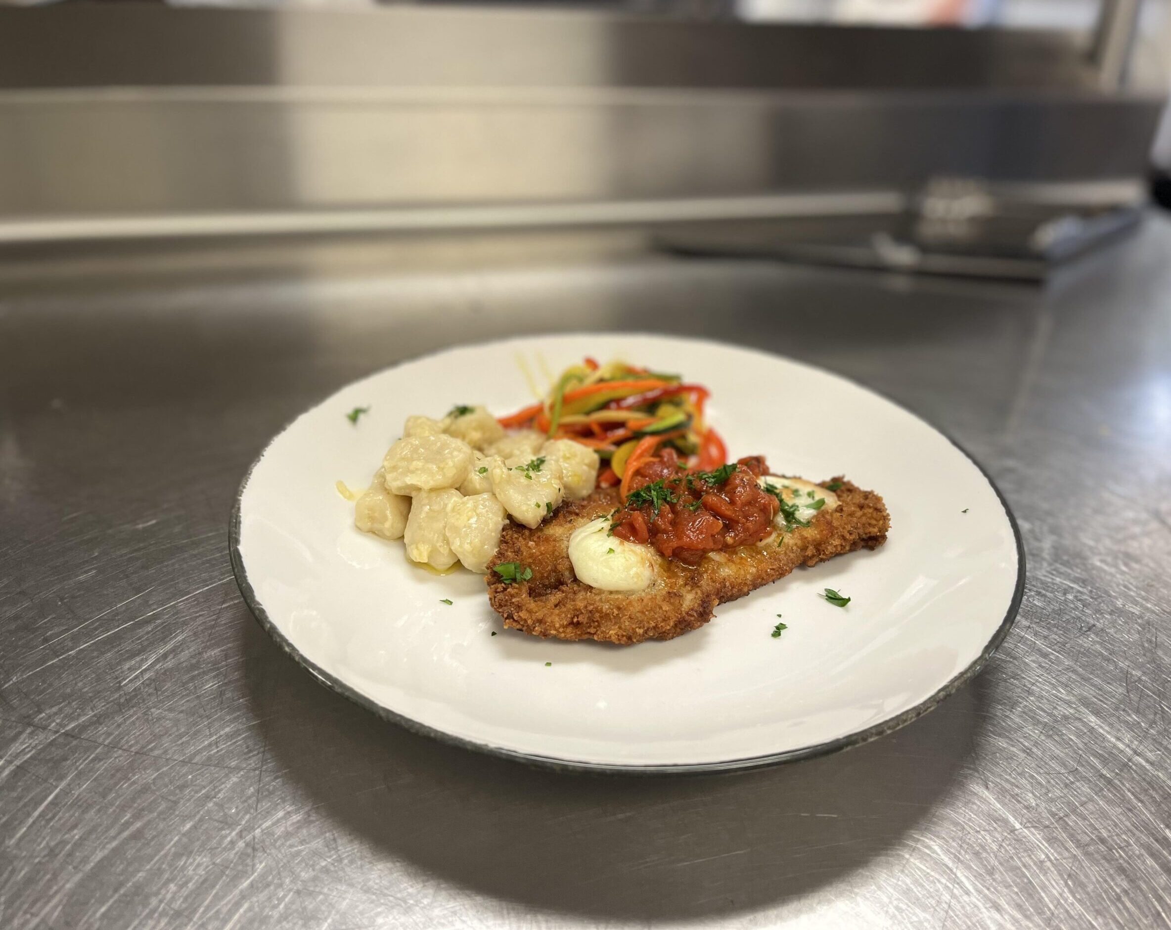 Veal Parmesan with Fresh Tomato Sauce, Potato Gnocchi, and Vegetable “Spaghetti”