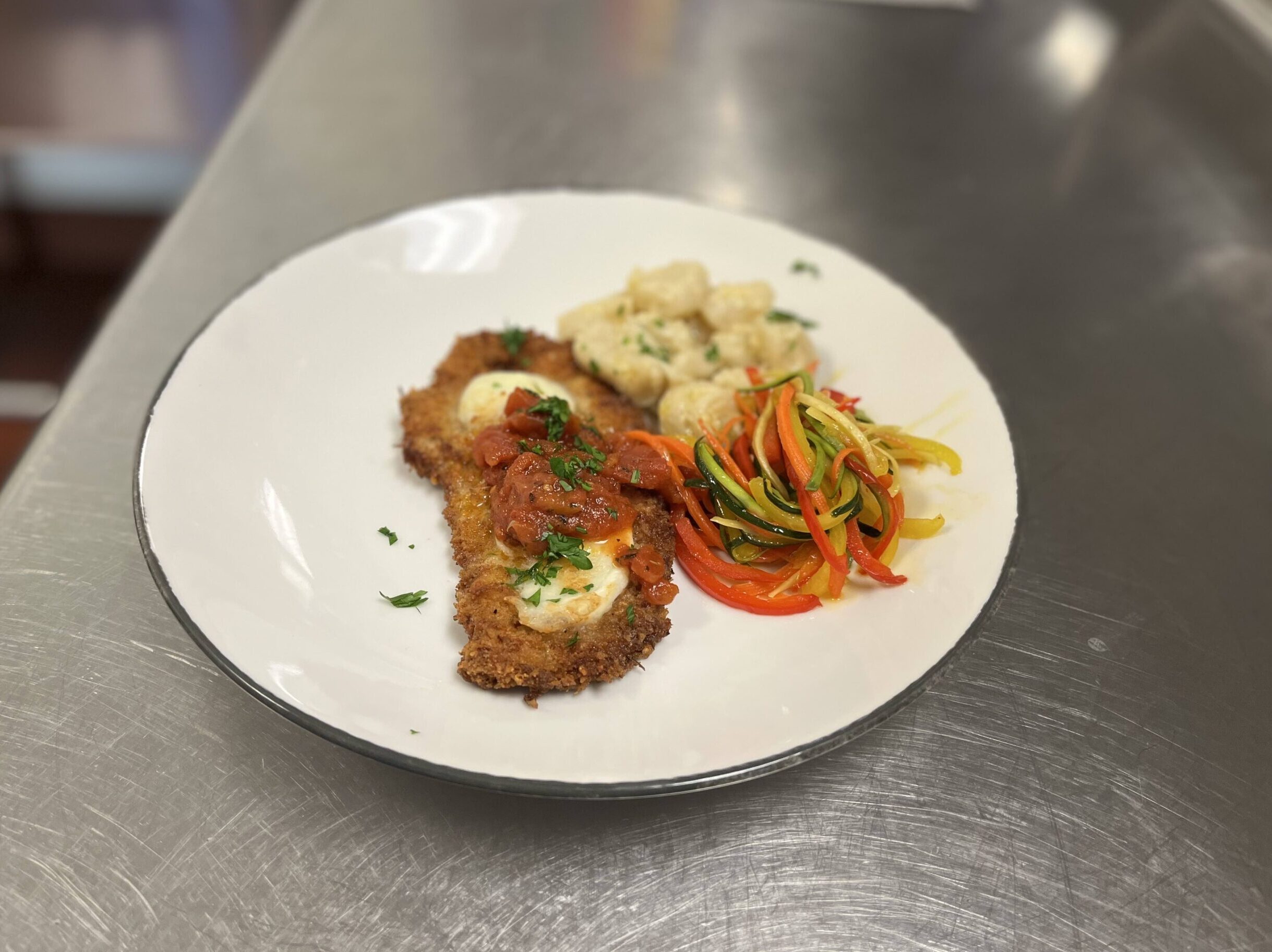 Veal Parmesan with Fresh Tomato Sauce, Potato Gnocchi, and Vegetable “Spaghetti”