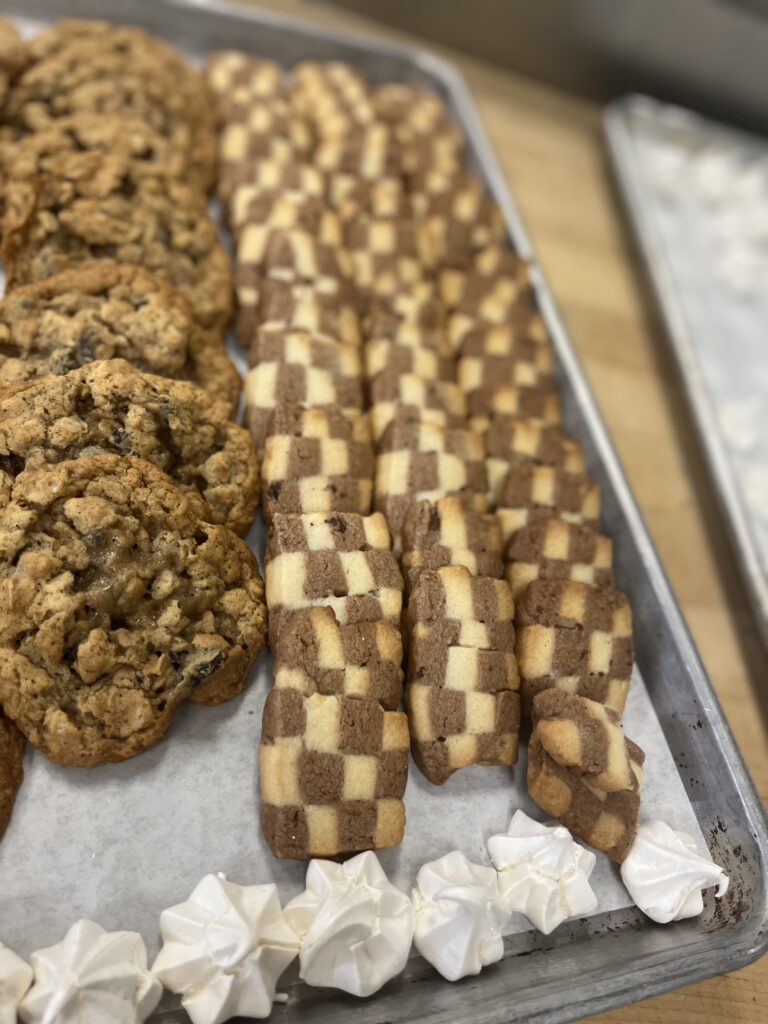 Checkered Cookies beside Oatmeal Cookies and some Meringue on the side.