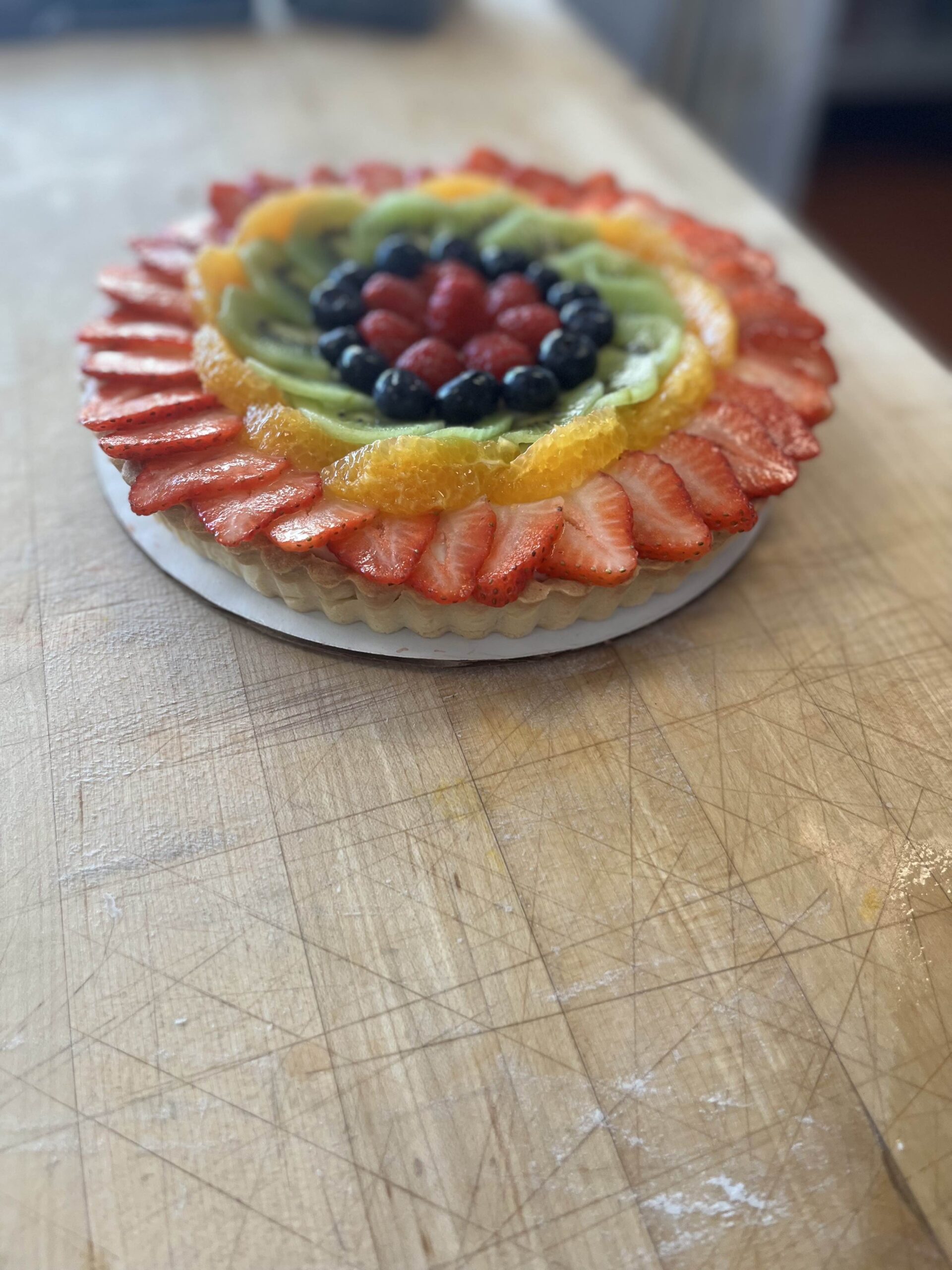 Fruit Tart covered Strawberries, Oranges, Kiwis, Blueberries and Raspberries.