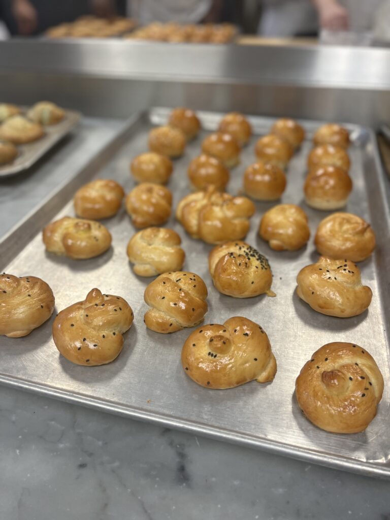 Dinner rolls variations, knots some with sesame seeds.