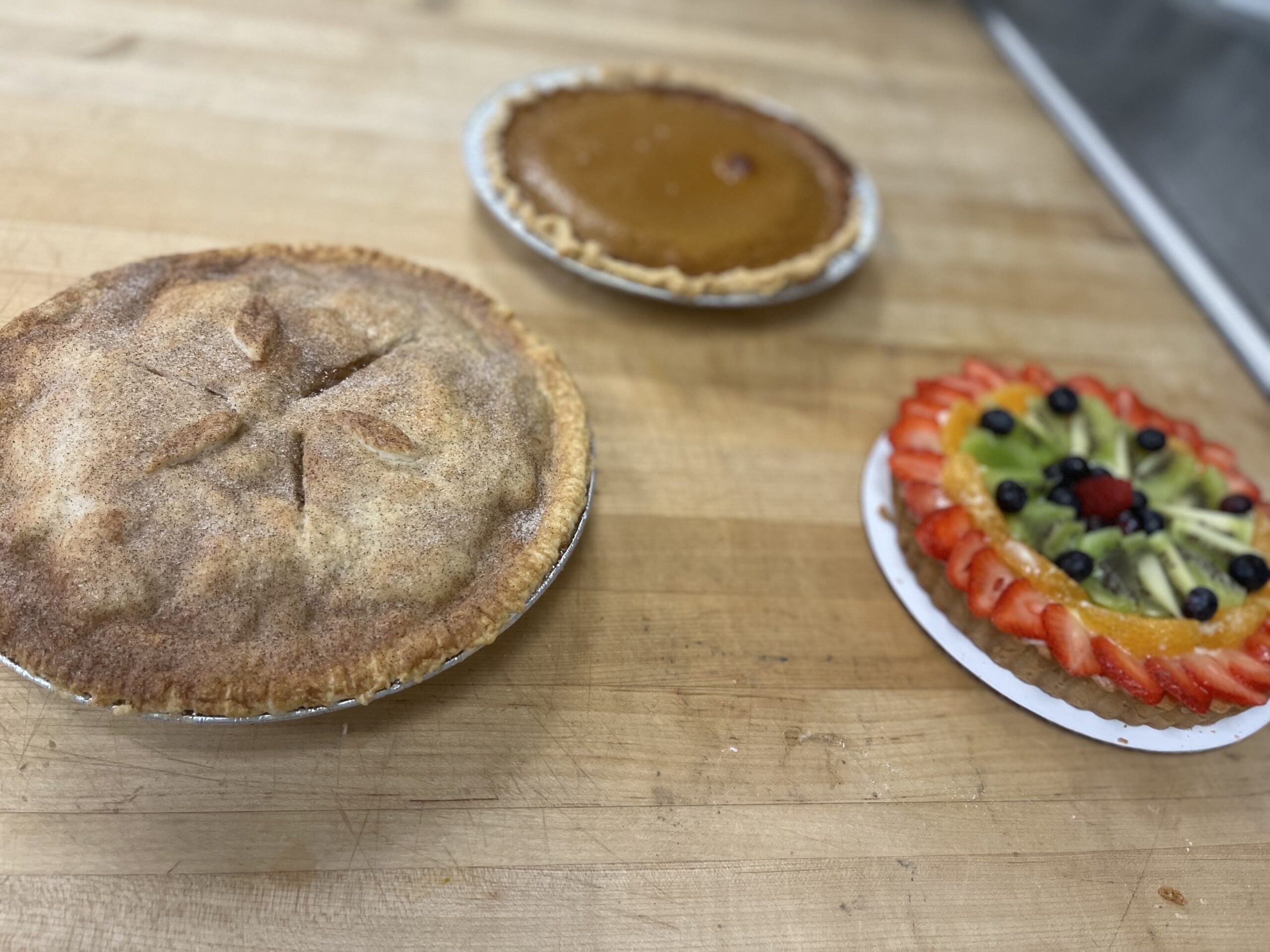 Tart and Pies, Apple Pie with Traditional Crust in the foreground.