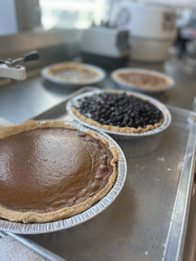 Four pies, Pumpkin Pie in the foreground