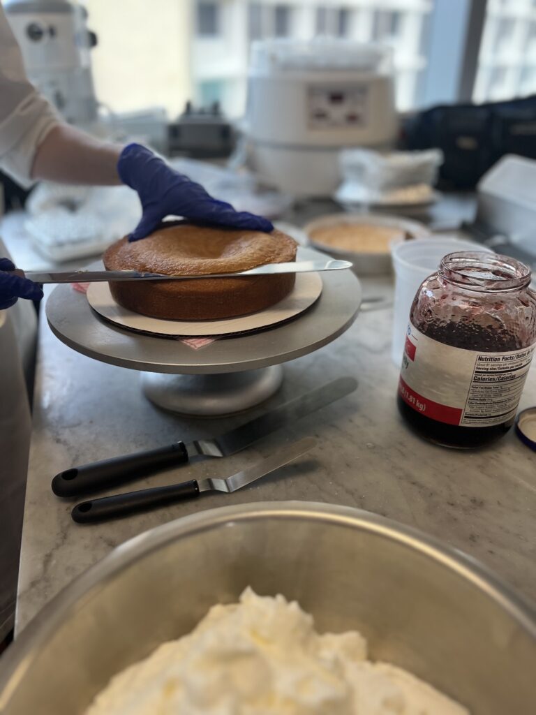 Leveling each part of the cake before we stack them.